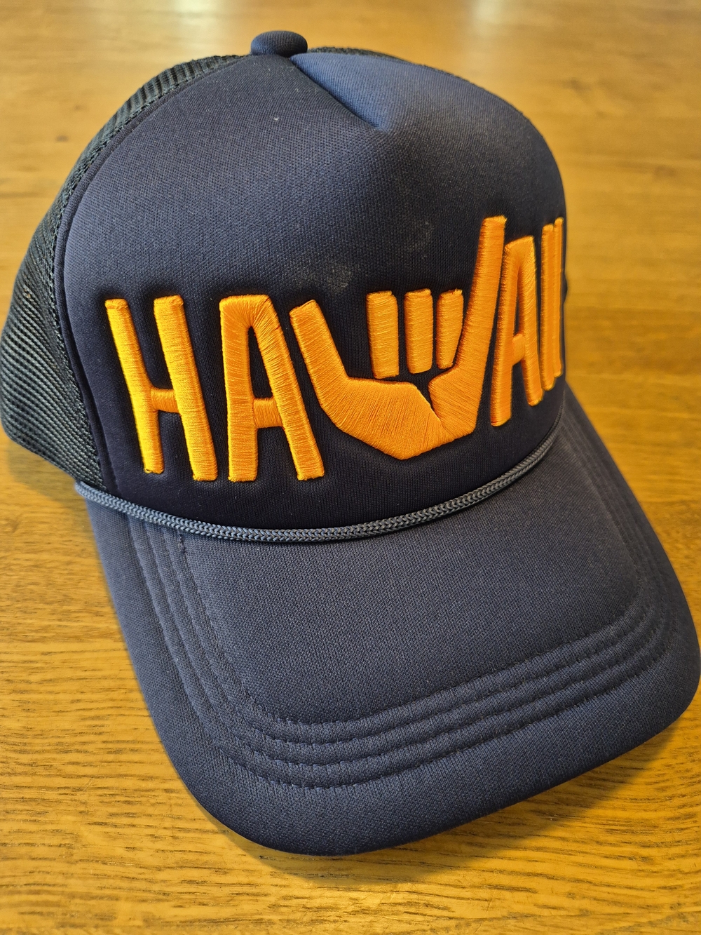 Navy Trucker Hat with Orange Embroidered 'Hawaii' Shaka